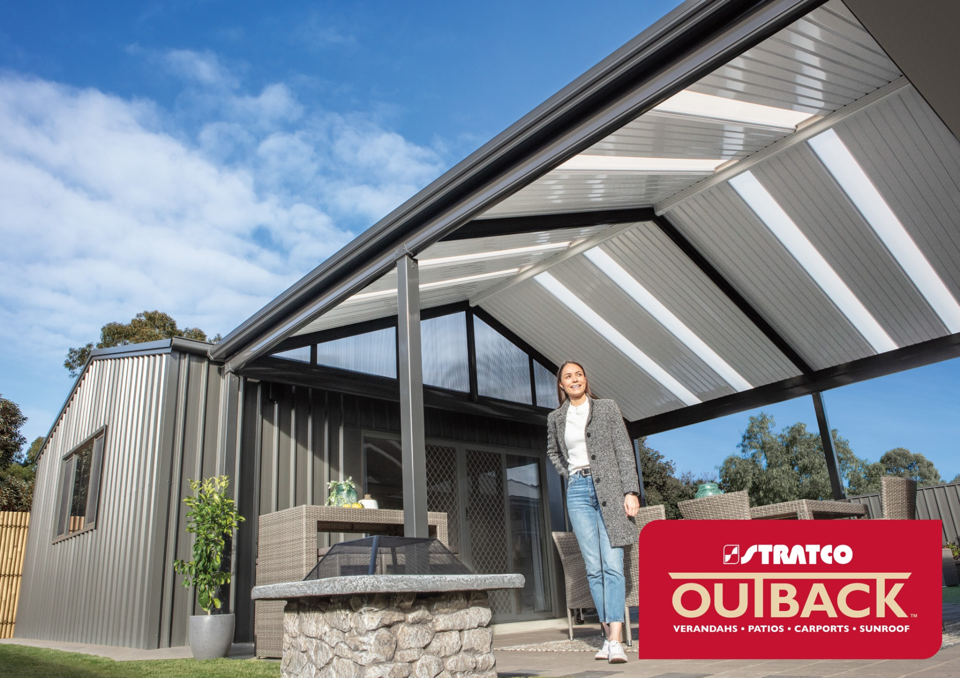 Stratco Outback gable patio with translucent roof sheeting attached to a home — Stratco product imagery