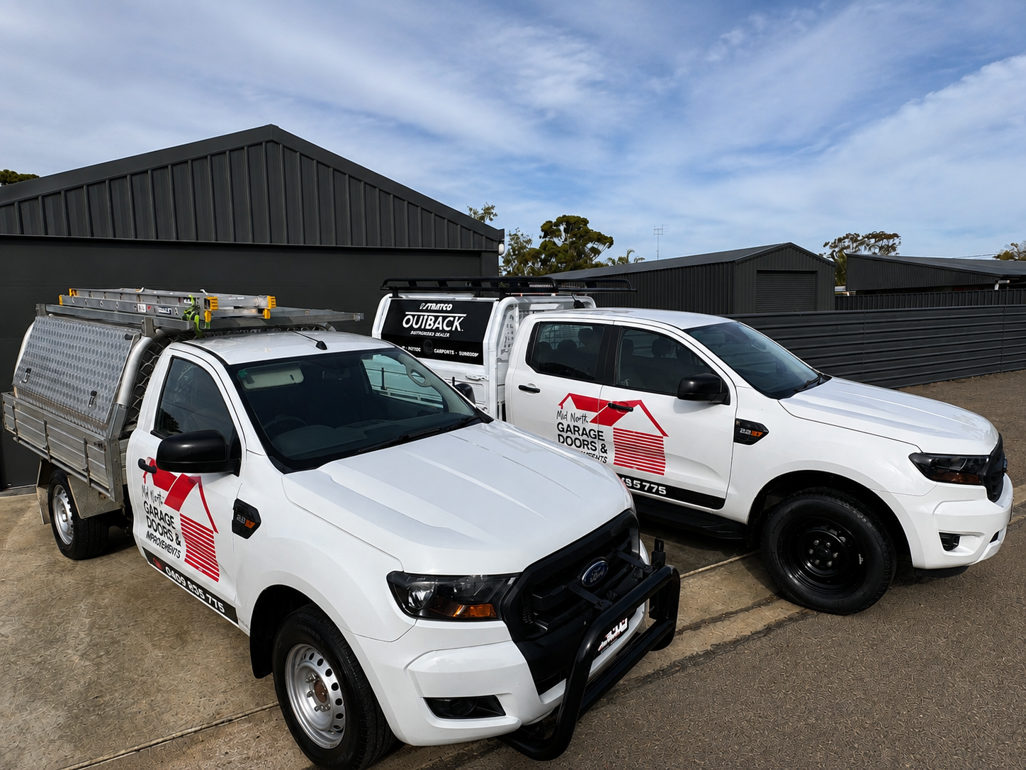 Mid North Garage Doors & Home Improvements branded work vehicles on site at a completed project in South Australia.